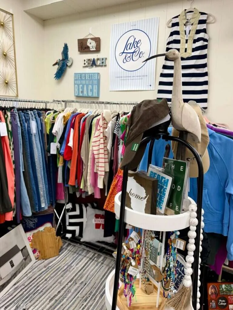 Antique furniture and collectibles arranged in a vendor space