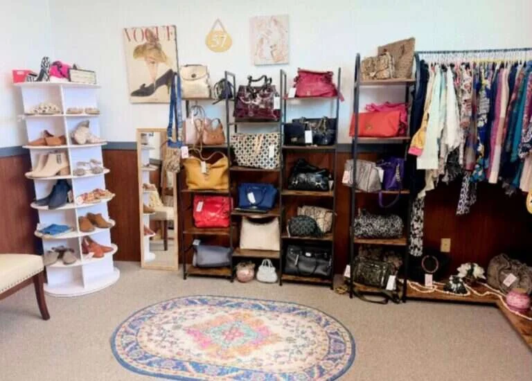 Booth 57 at Twisted Sisters Vintage Market, a boutique display of handbags, shoes, scarves and clothing